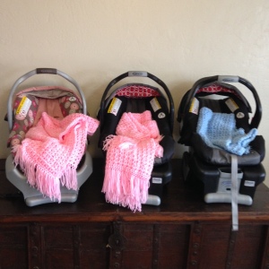 baby car seats waiting for their future occupants